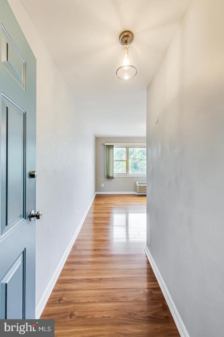 604 Longfellow Street Northwest, Unit 303 Washington, DC 20011 - Photo 3 of 12 a view of an entryway with wooden floor