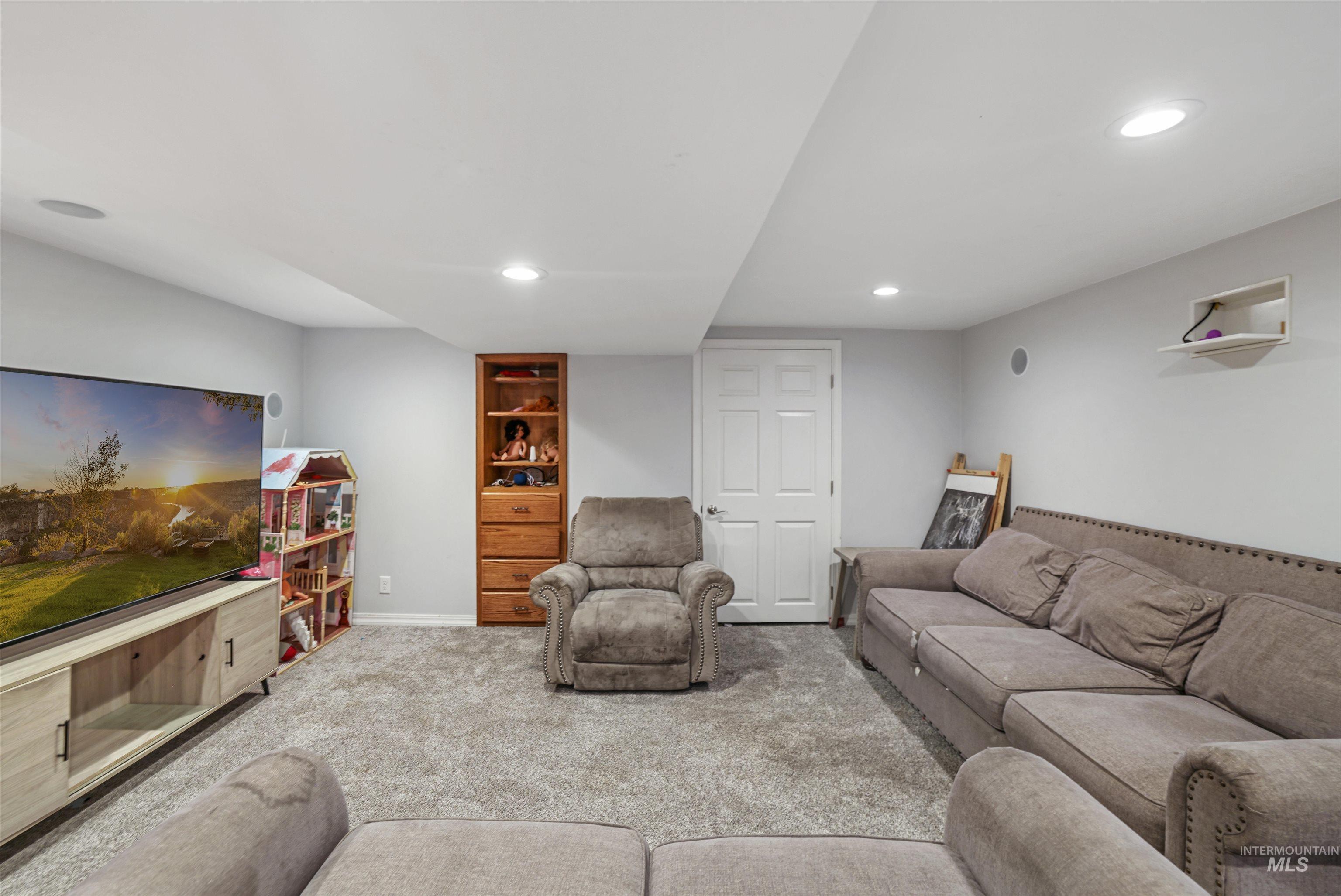 201 West 19th Street Burley, ID 83318 - Photo 13 of 31 Living area with carpet and recessed lighting
