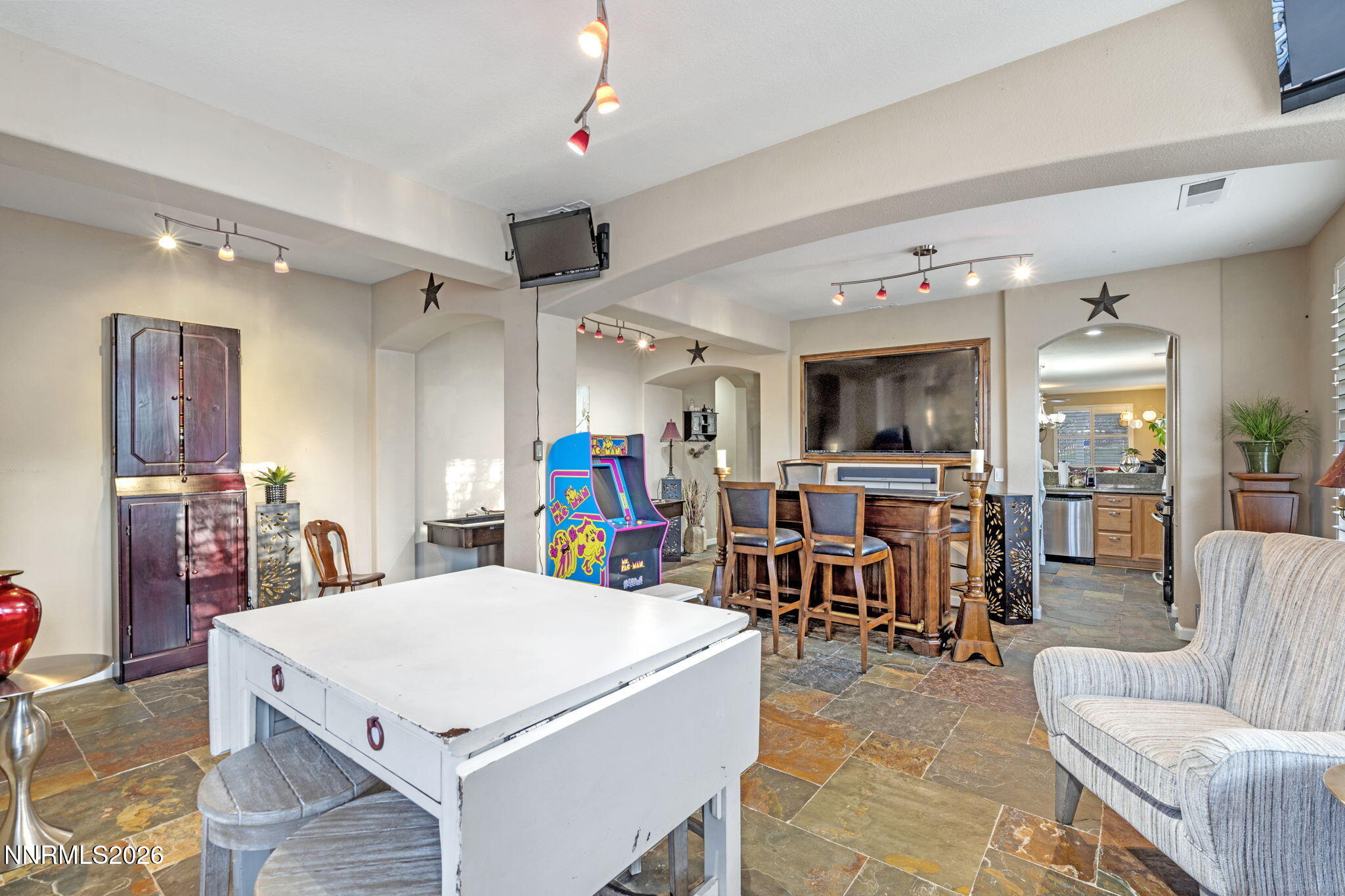 3239 Banestone Road Sparks, NV 89436 - Photo 16 of 38 a view of a dining room with furniture and a chandelier