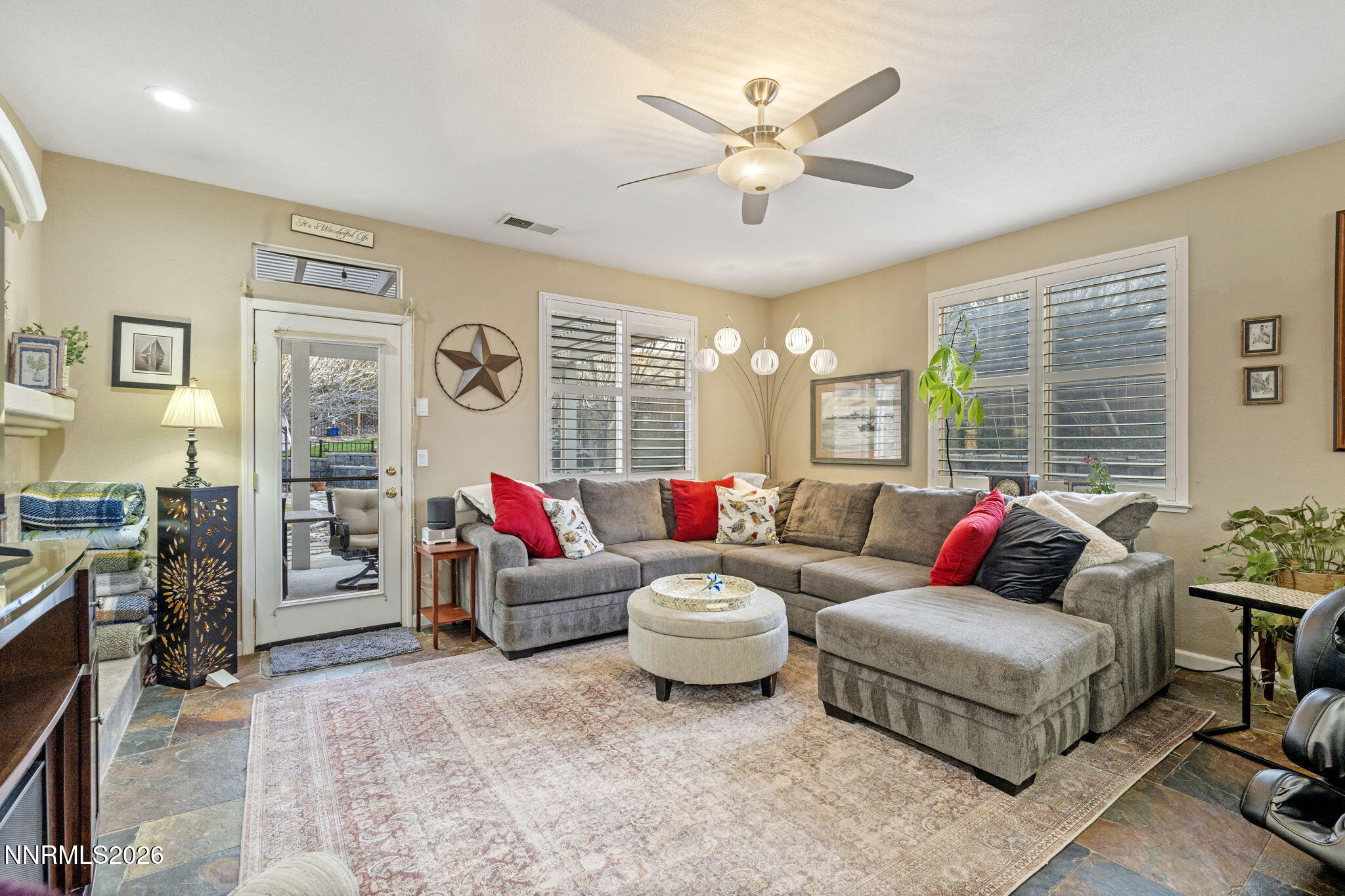 3239 Banestone Road Sparks, NV 89436 - Photo 20 of 38 a living room with furniture and a flat screen tv
