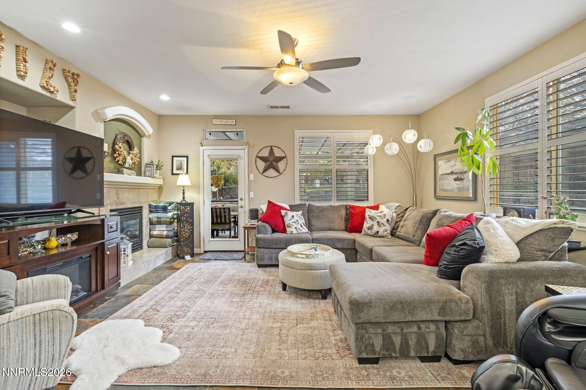 3239 Banestone Road Sparks, NV 89436 - Photo 21 of 38 a living room with furniture and a flat screen tv