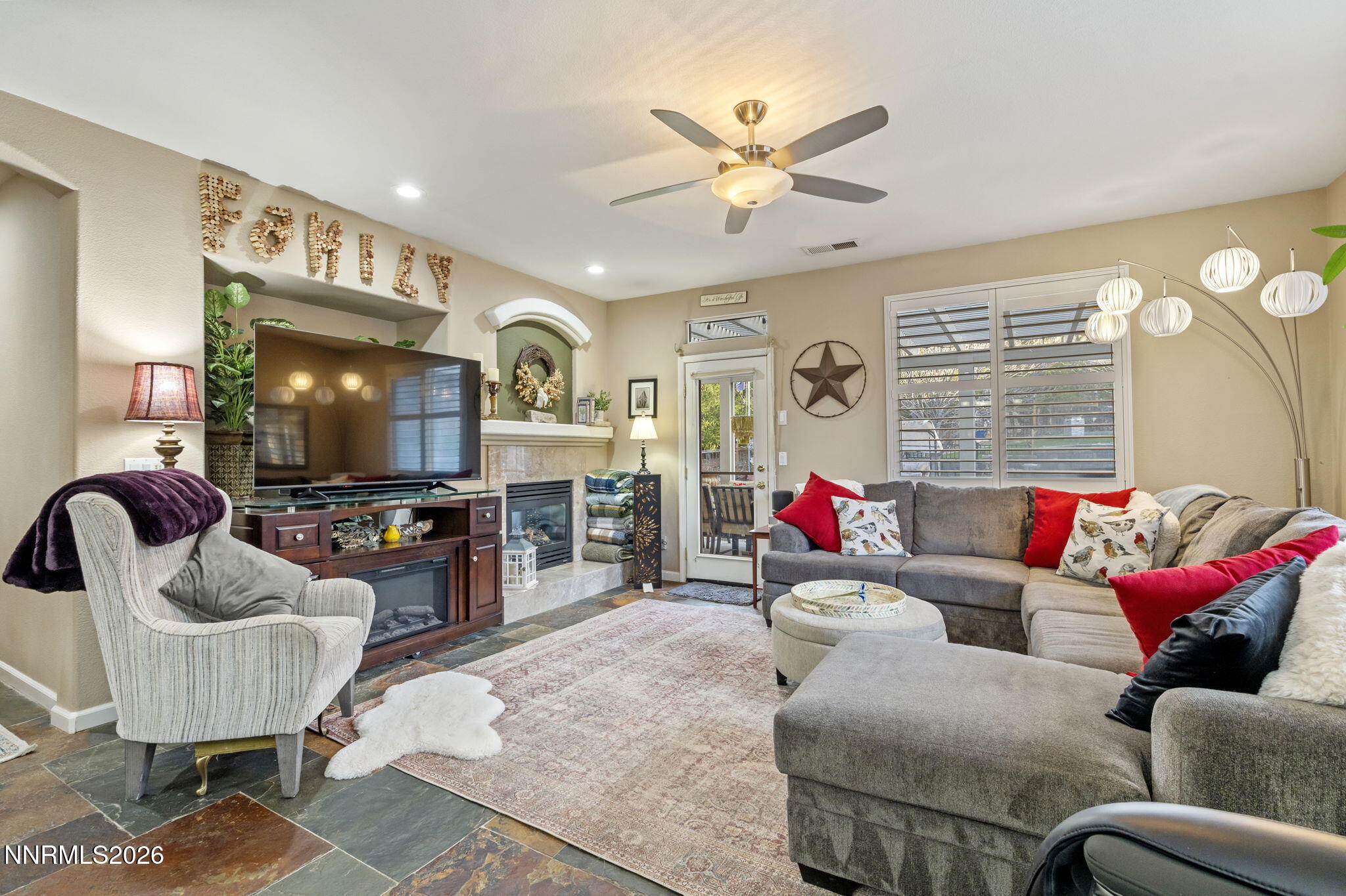 3239 Banestone Road Sparks, NV 89436 - Photo 22 of 38 a living room with furniture and a flat screen tv