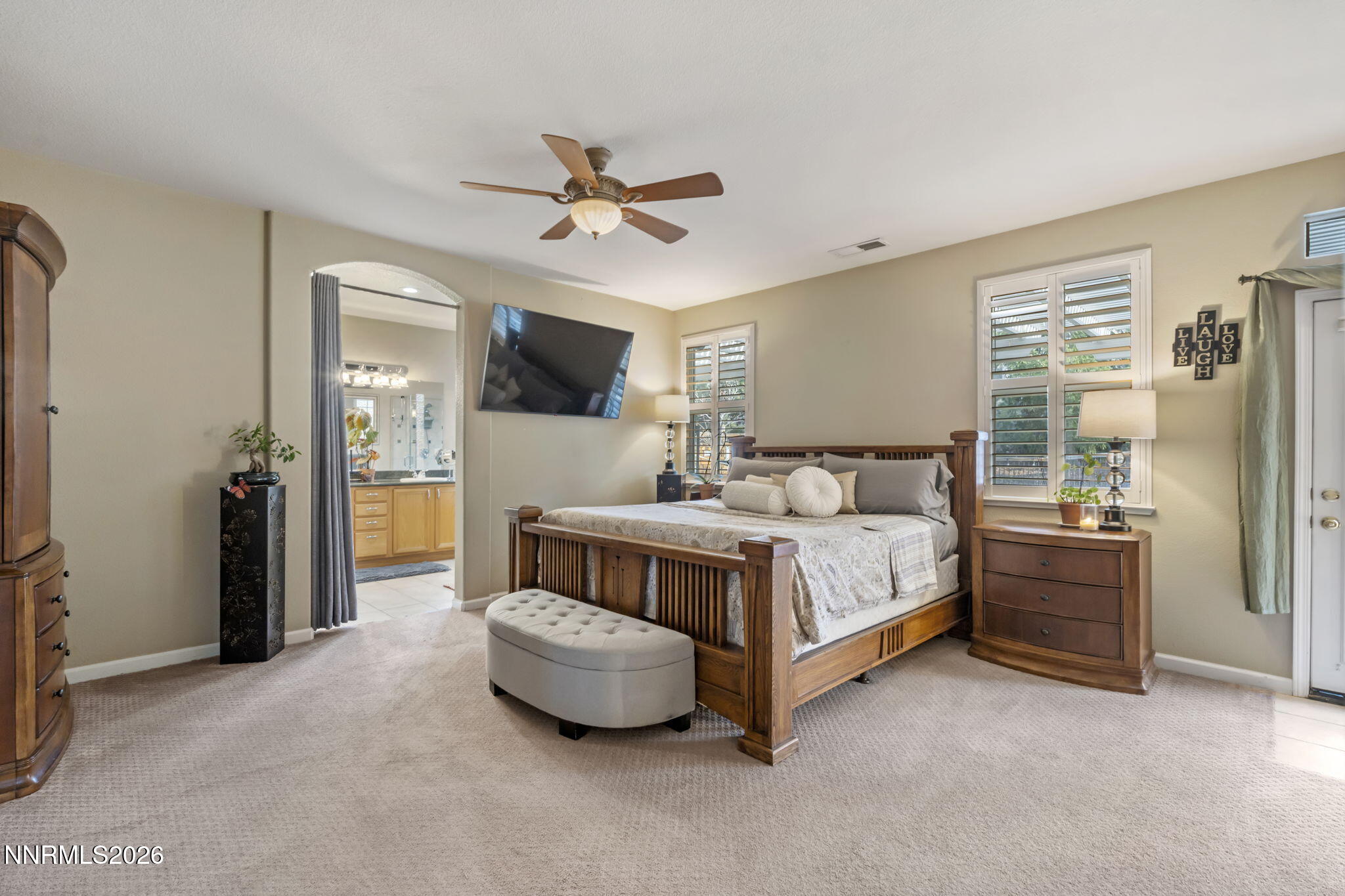 3239 Banestone Road Sparks, NV 89436 - Photo 28 of 38 a bedroom with a bed and a chandelier