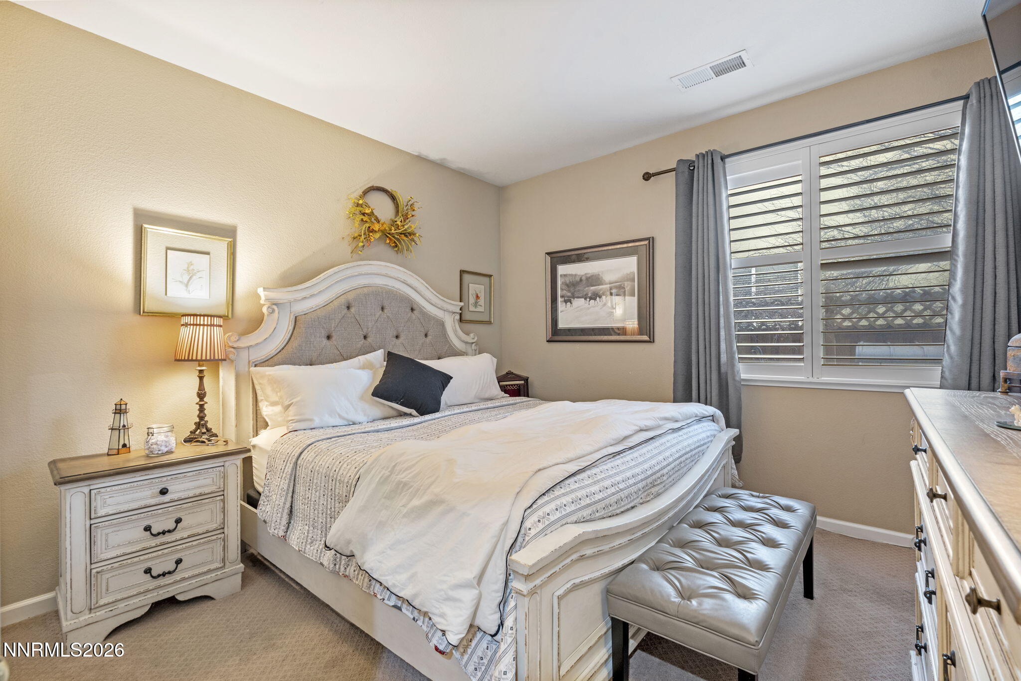 3239 Banestone Road Sparks, NV 89436 - Photo 30 of 38 a bedroom with a bed and a chandelier