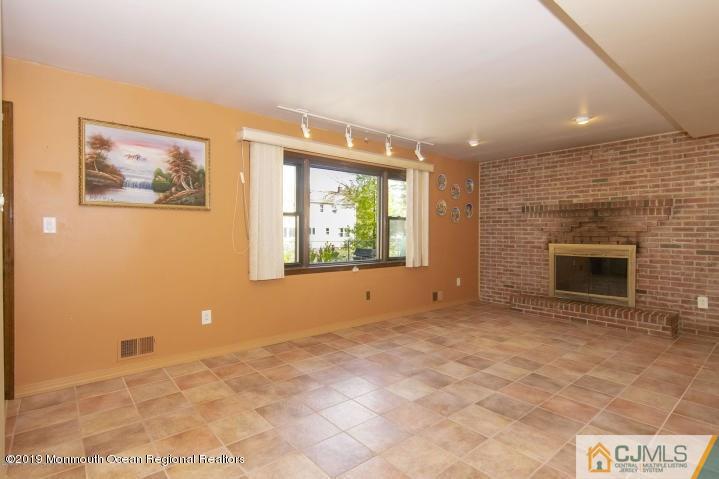 8 Purdue Road Edison, NJ 08820 - Photo 14 of 15 a view of empty room with a fireplace