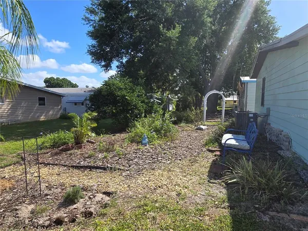 a backyard of a house with lots of green space