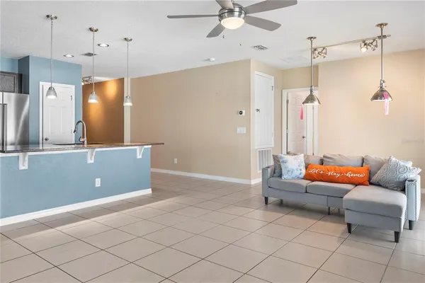a kitchen with stainless steel appliances granite countertop a sink and a stove