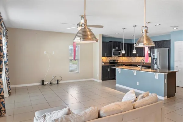 a view of a room with wooden floor and window