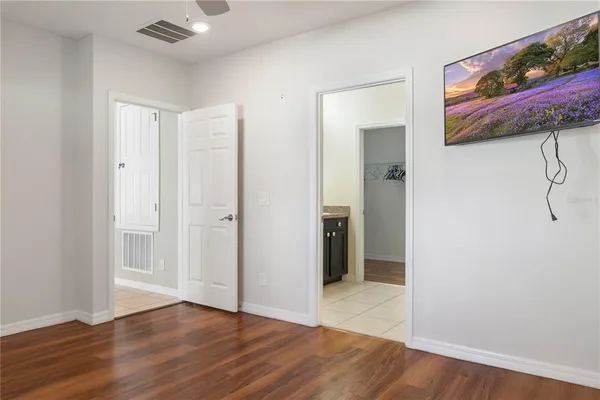 a bathroom with a granite countertop sink double vanity and a mirror