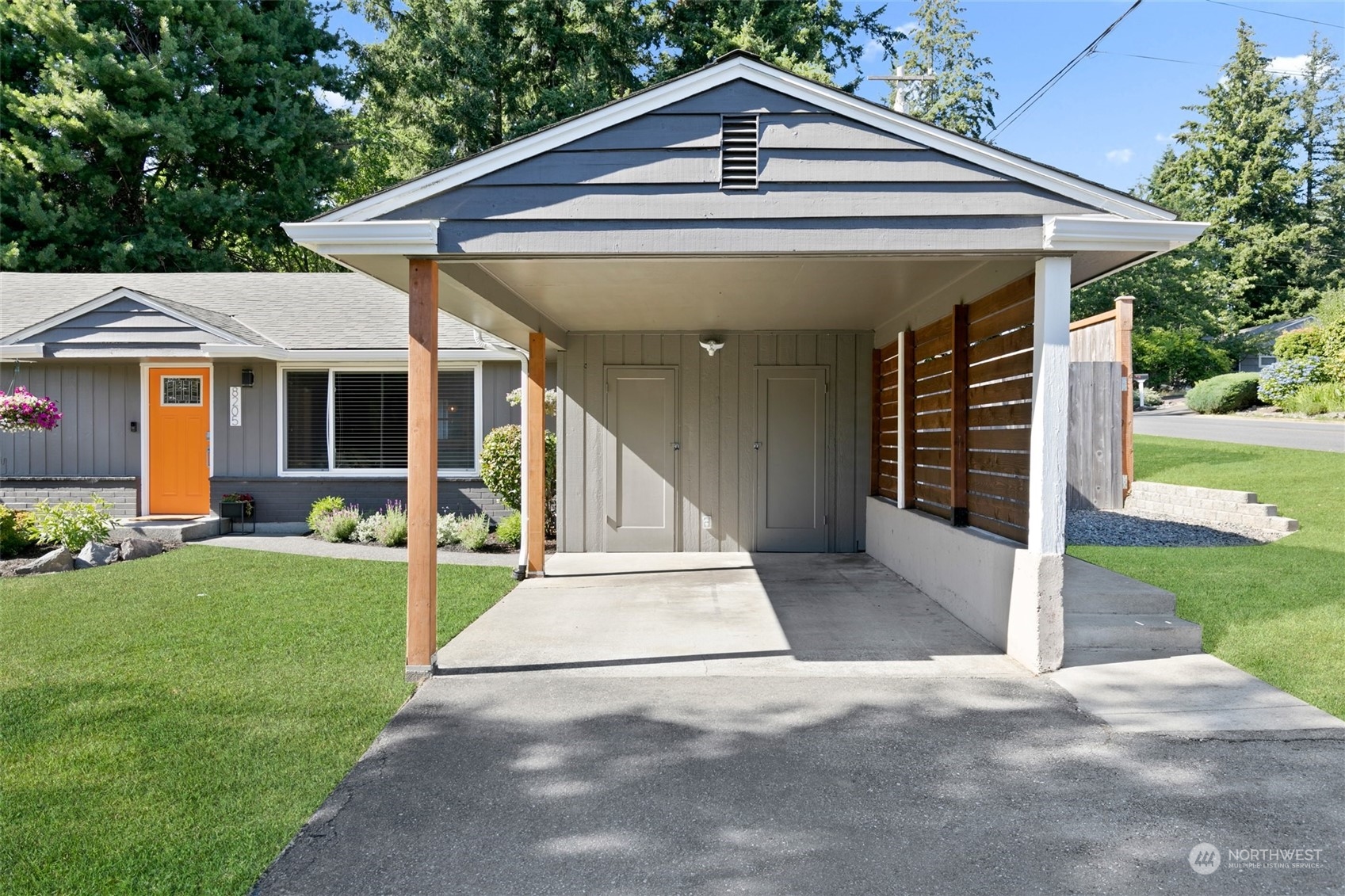 8205 208th Street Southwest Edmonds, WA 98026 - Photo 3 of 39 a front view of a house with a yard