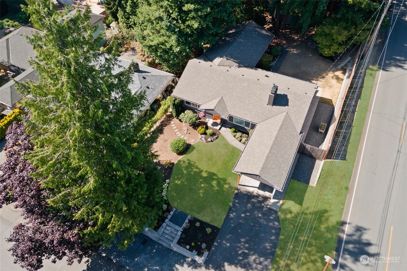 8205 208th Street Southwest Edmonds, WA 98026 - Photo 34 of 39 an aerial view of a house with outdoor space and parking