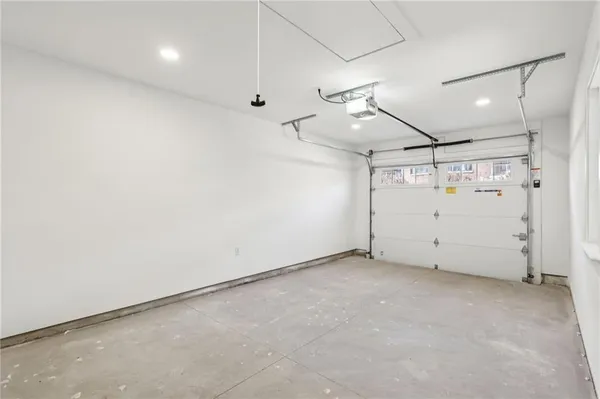 a view of hallway with wooden floor