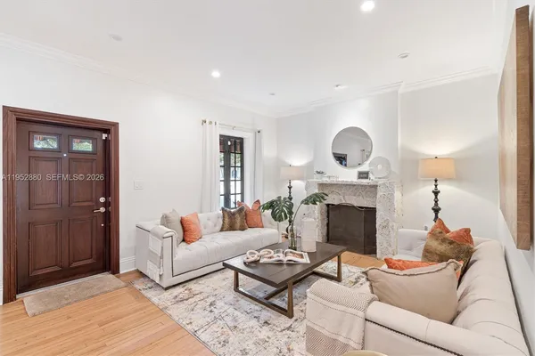 a living room with furniture and a fireplace