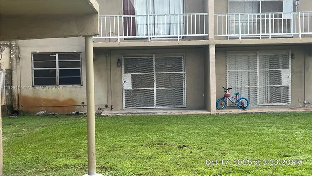 a view of front door of house with yard