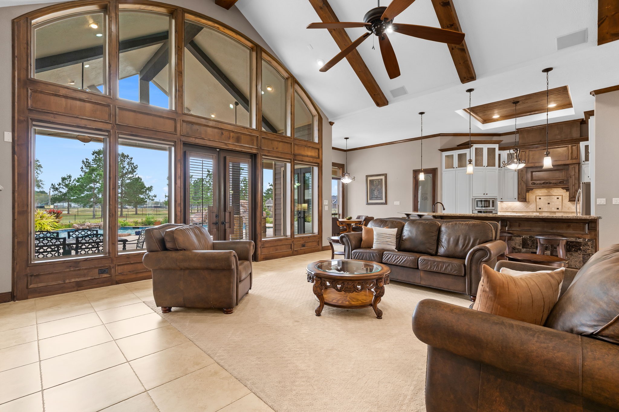 11009 Darby Loop Conroe, TX 77385 - Photo 26 of 43 The living room flows seamlessly into the kitchen, creating an open, inviting space ideal for everyday living and entertaining.