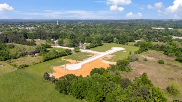a view of a lake with a yard