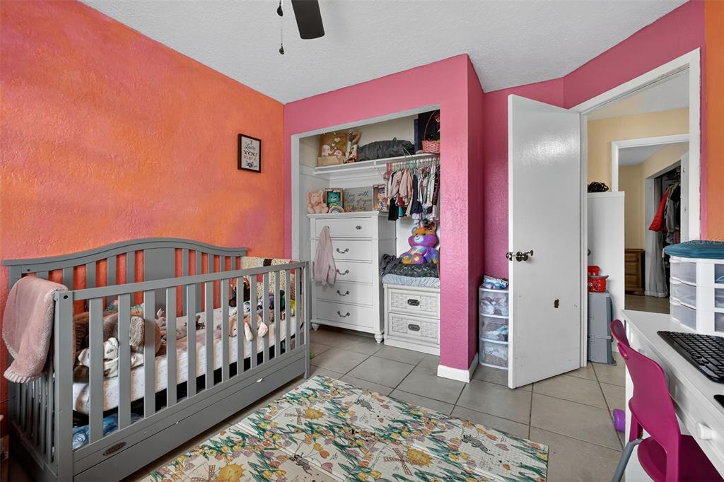 1644 Ruth Street Cocoa, FL 32926 - Photo 17 of 38 a bedroom with furniture and baby crib