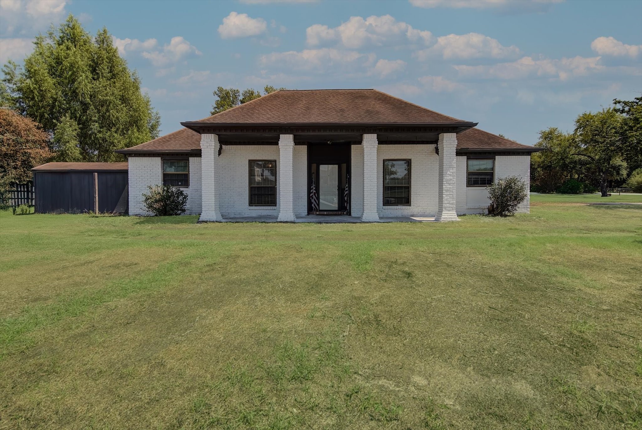 26822 Prairie Lane Katy, TX 77494 - Photo 12 of 30 a front view of a house with a garden