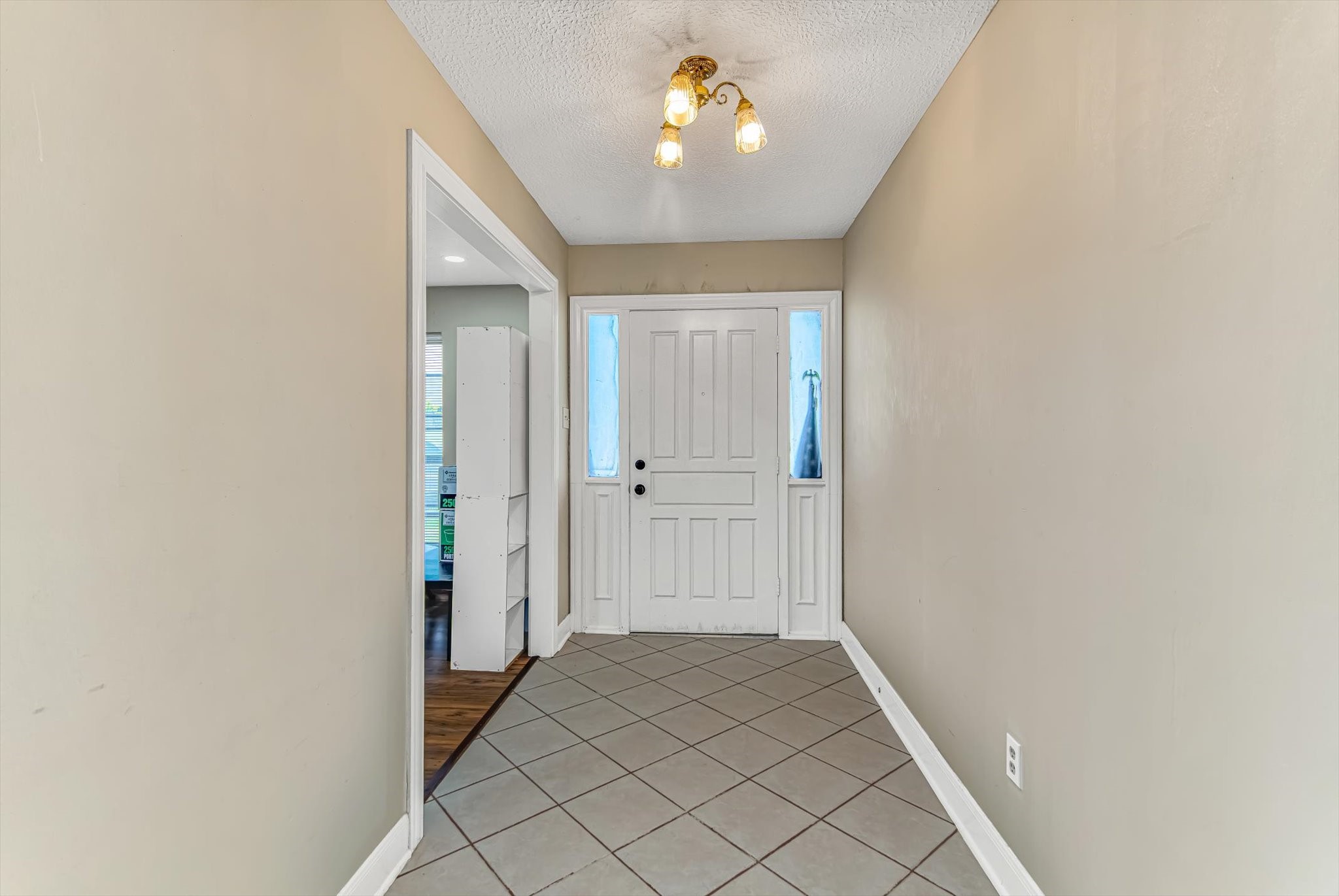 26822 Prairie Lane Katy, TX 77494 - Photo 14 of 30 a view of a hallway with a chandelier fan