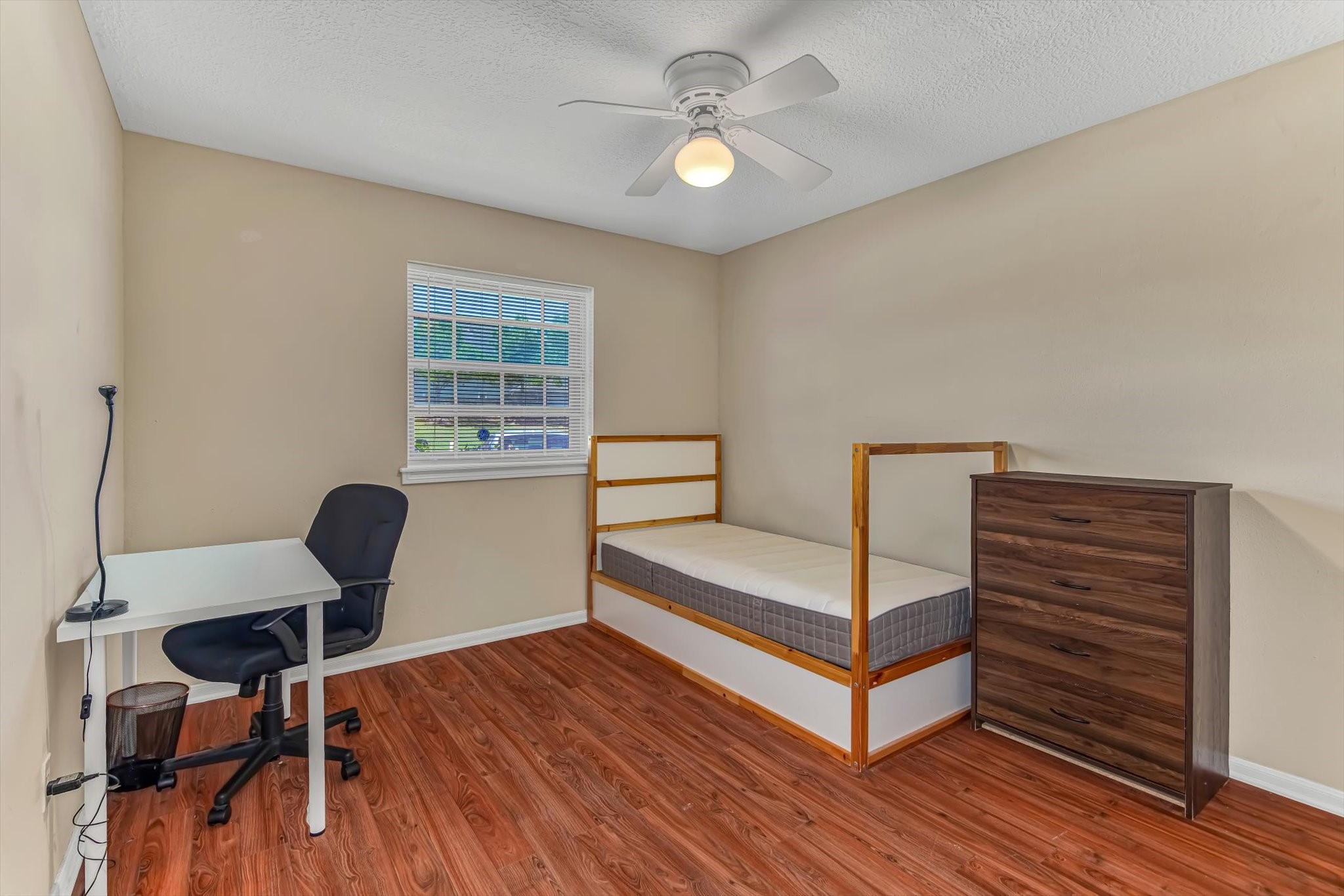 26822 Prairie Lane Katy, TX 77494 - Photo 22 of 30 a living room with furniture a wooden floor and a chandelier