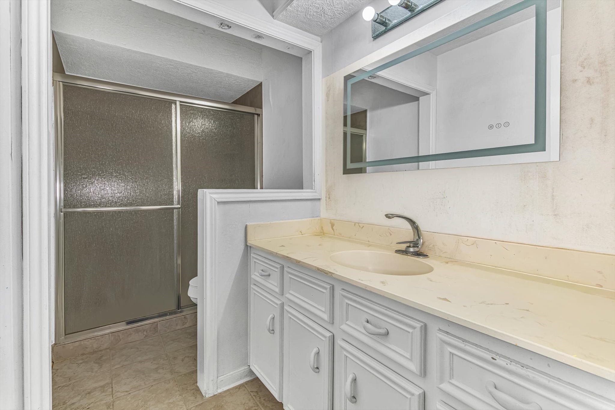 26822 Prairie Lane Katy, TX 77494 - Photo 23 of 30 a bathroom with a sink and a mirror
