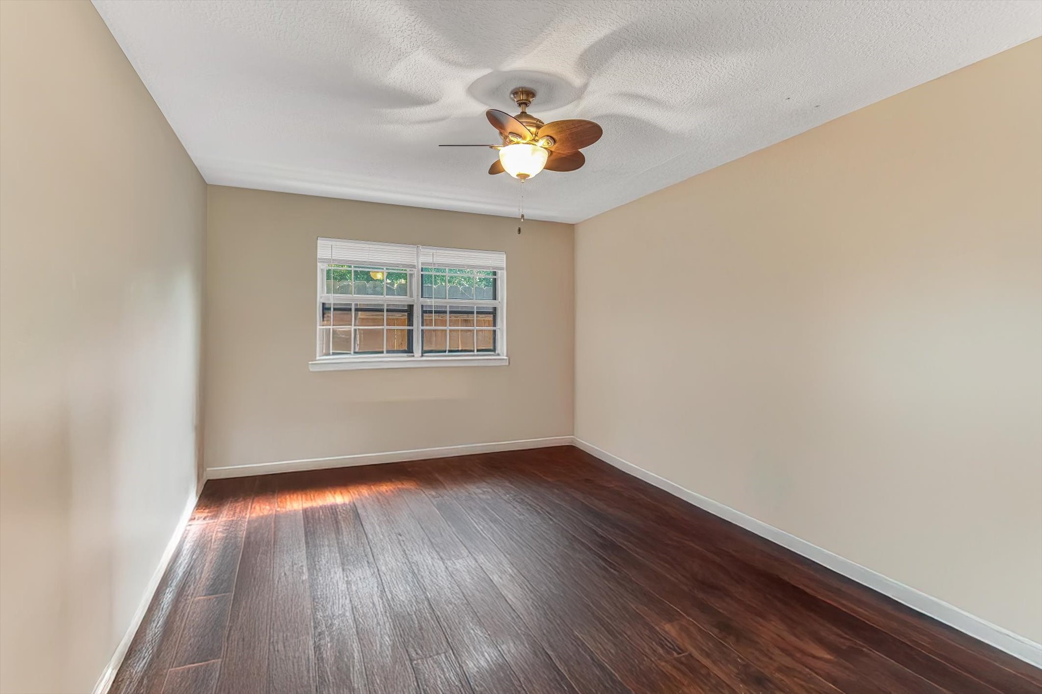 26822 Prairie Lane Katy, TX 77494 - Photo 24 of 30 wooden floor in an empty room with a window