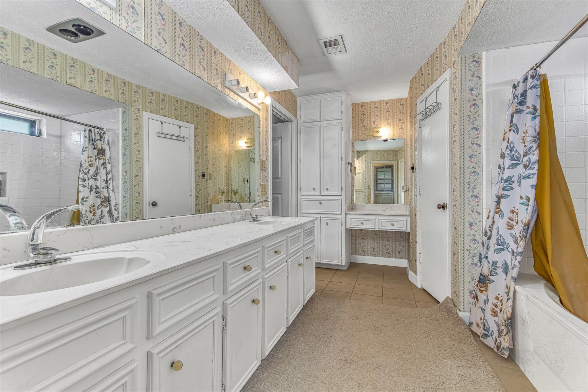 26822 Prairie Lane Katy, TX 77494 - Photo 25 of 30 a spacious bathroom with a double vanity sink a large mirror and shower