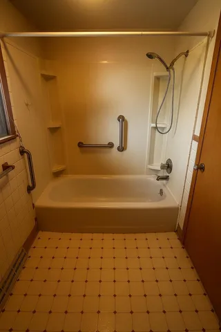 a bathroom with a bathtub and a shower