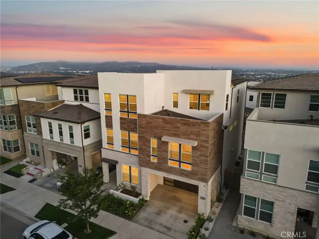 a front view of a building with a lot of windows