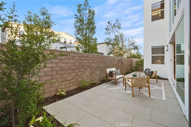 a view of a patio with couple of chairs