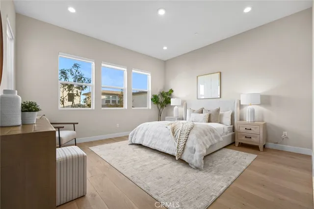 a spacious bedroom with a large bed and a couch