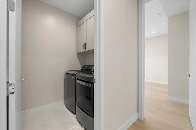 a storage room with washer and dryer