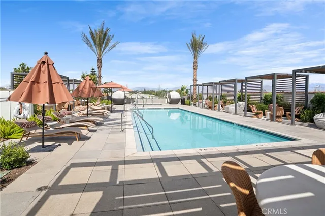 a view of a swimming pool with a lounge chairs