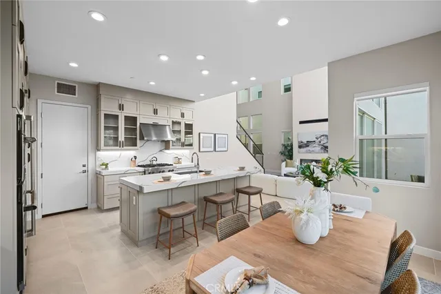 a kitchen with a table and chairs