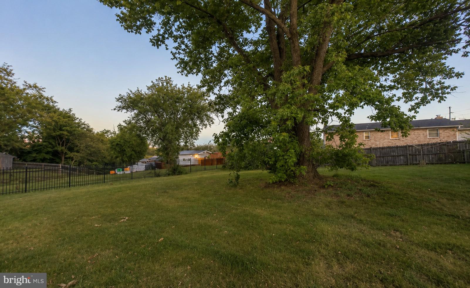 11312 Old Fort Road Fort Washington, MD 20744 - Photo 13 of 13 a view of outdoor space with green field and trees all around