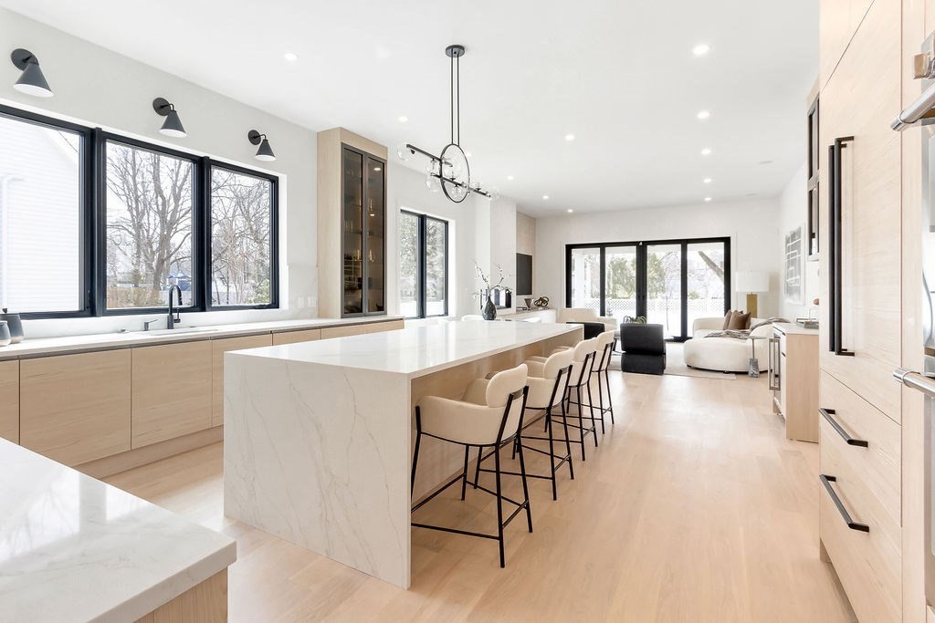 180 Wiswall Road Newton, MA 02459 - Photo 3 of 41 a living room with furniture a large window and wooden floor