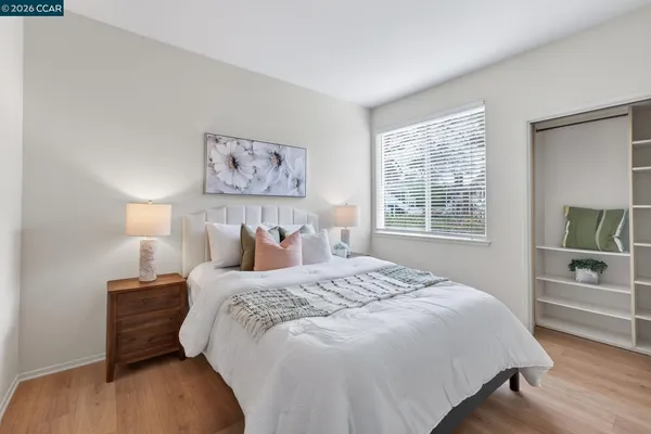 a bedroom with a bed and a window