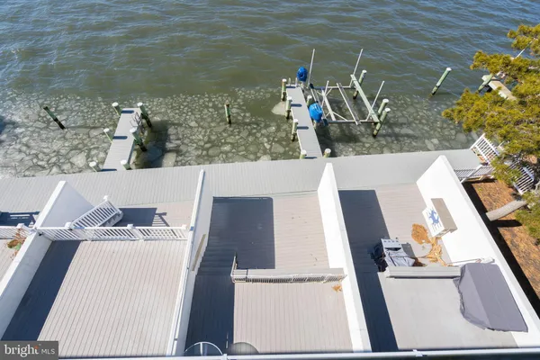a view of swimming pool with sitting area