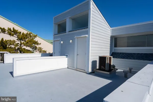 a view of living room kitchen with furniture and flat screen tv