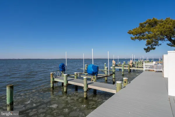 front view of a house with a bench
