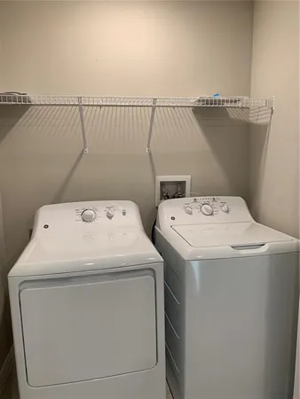 a view of a house with backyard and porch