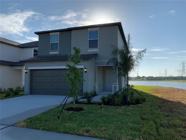 a view of a yard in front of a house with a yard