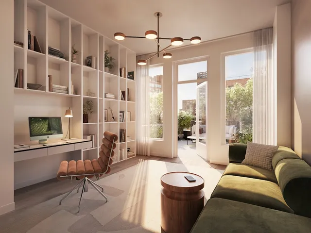 a living room with furniture and large windows