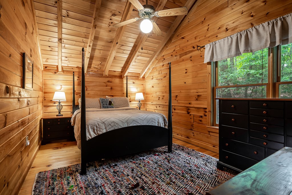 54 Ascherman Court Blue Ridge, GA 30513 - Photo 21 of 48 a bedroom with a bed and a dresser