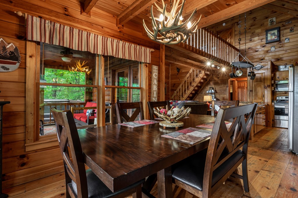 54 Ascherman Court Blue Ridge, GA 30513 - Photo 10 of 48 a dining room with furniture and wooden floor