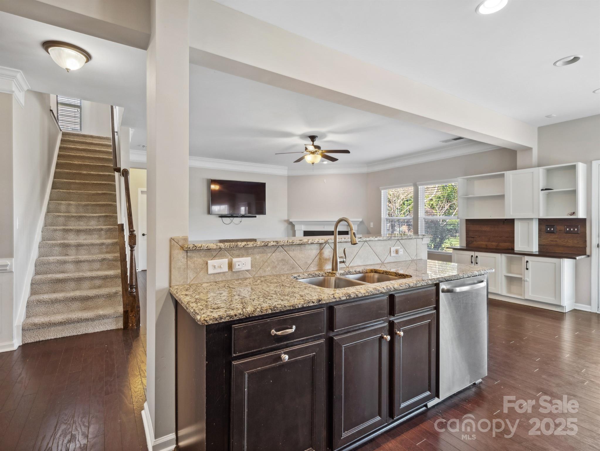 79357 Ridgehaven Road Lancaster, SC 29720 - Photo 11 of 42 a kitchen with a sink and a wooden cabinets
