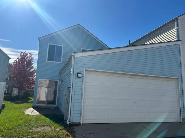 a view of a big yard with large trees
