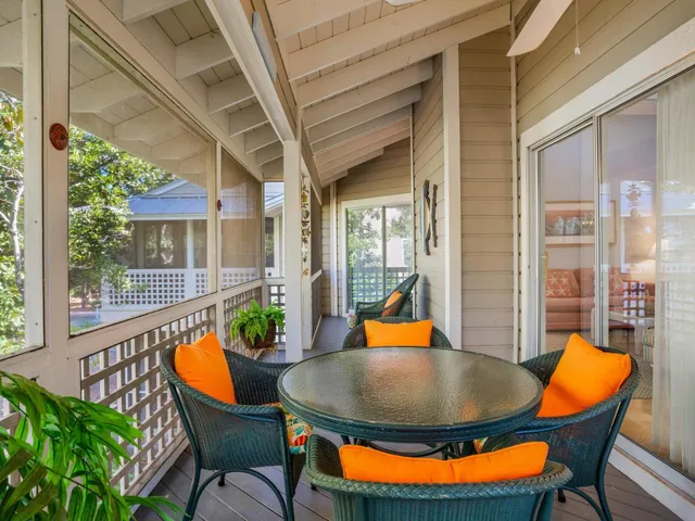 a view of a dining room with a table and chairs