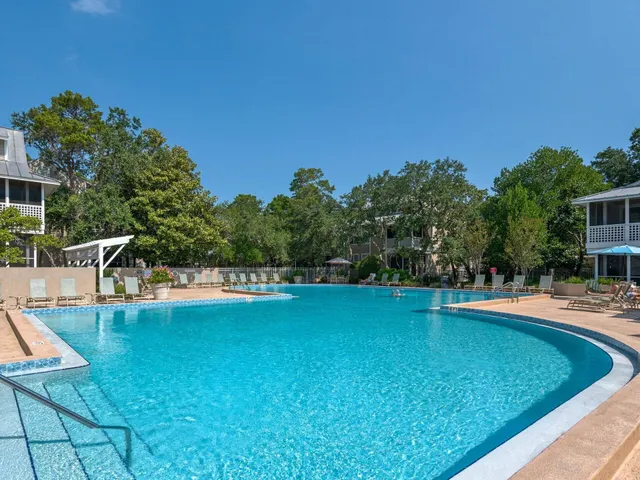 a view of a swimming pool with a lounge chairs