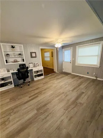 a kitchen with a stove a sink and a refrigerator